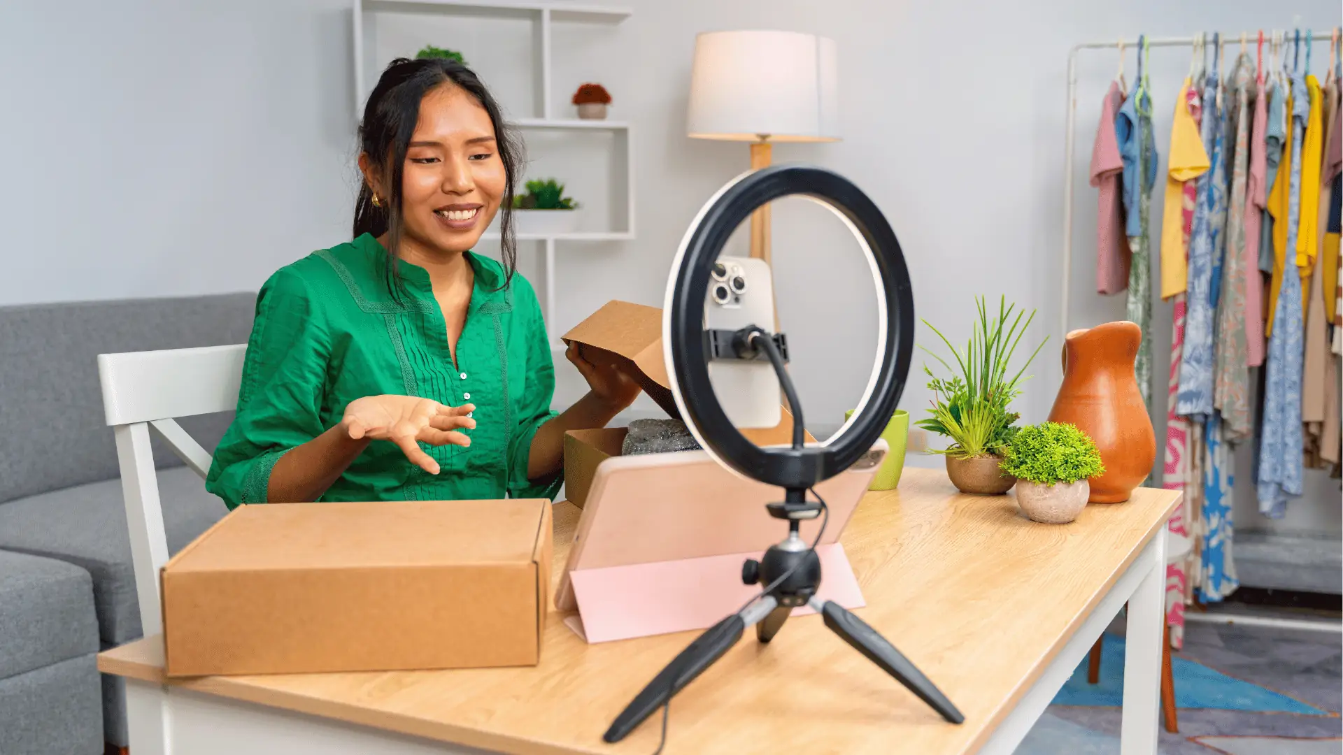 A solo social media manager planning content on a laptop and phone