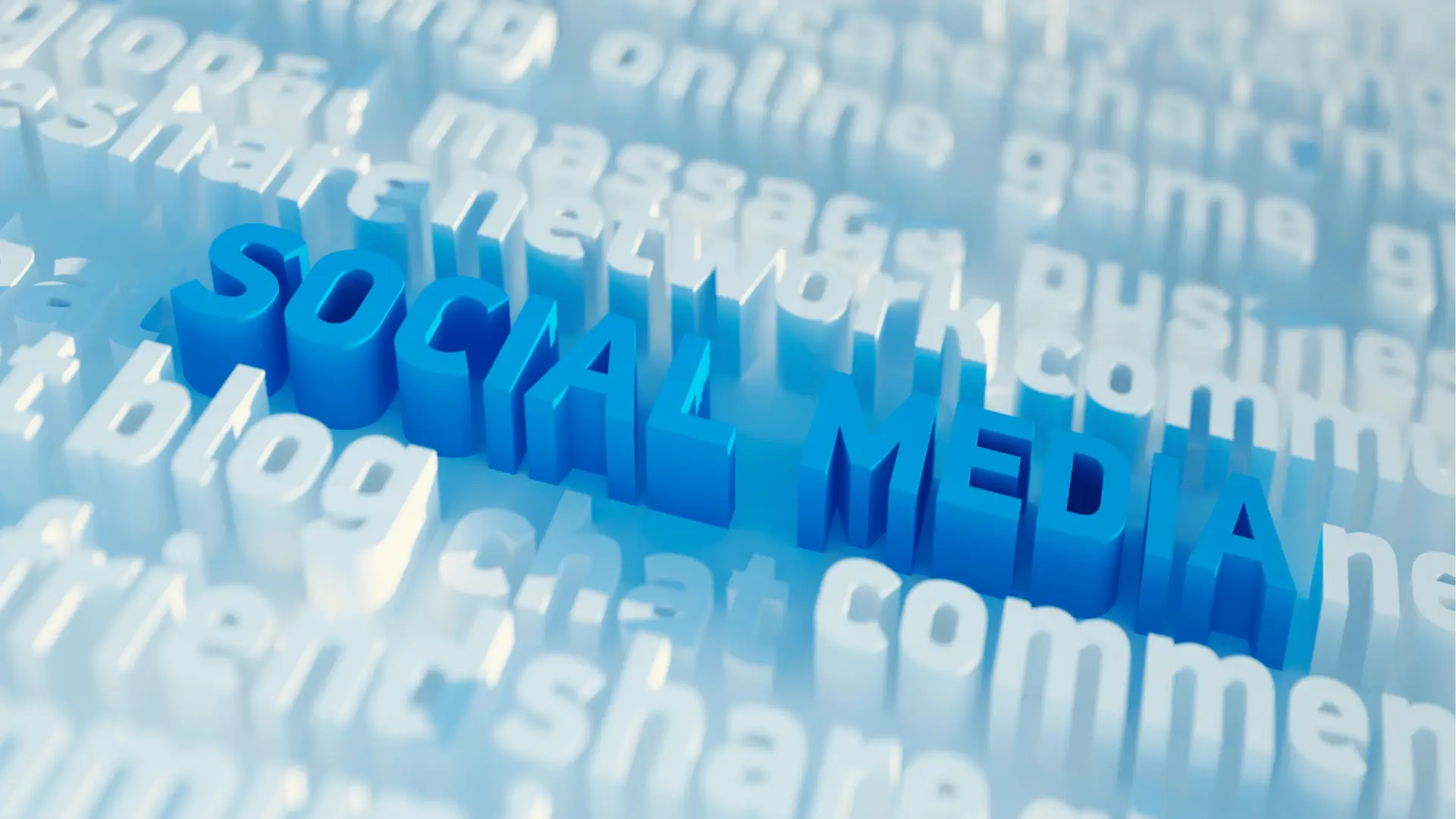 Blue three-dimensional raised text reading social media surrounded by blurred white words