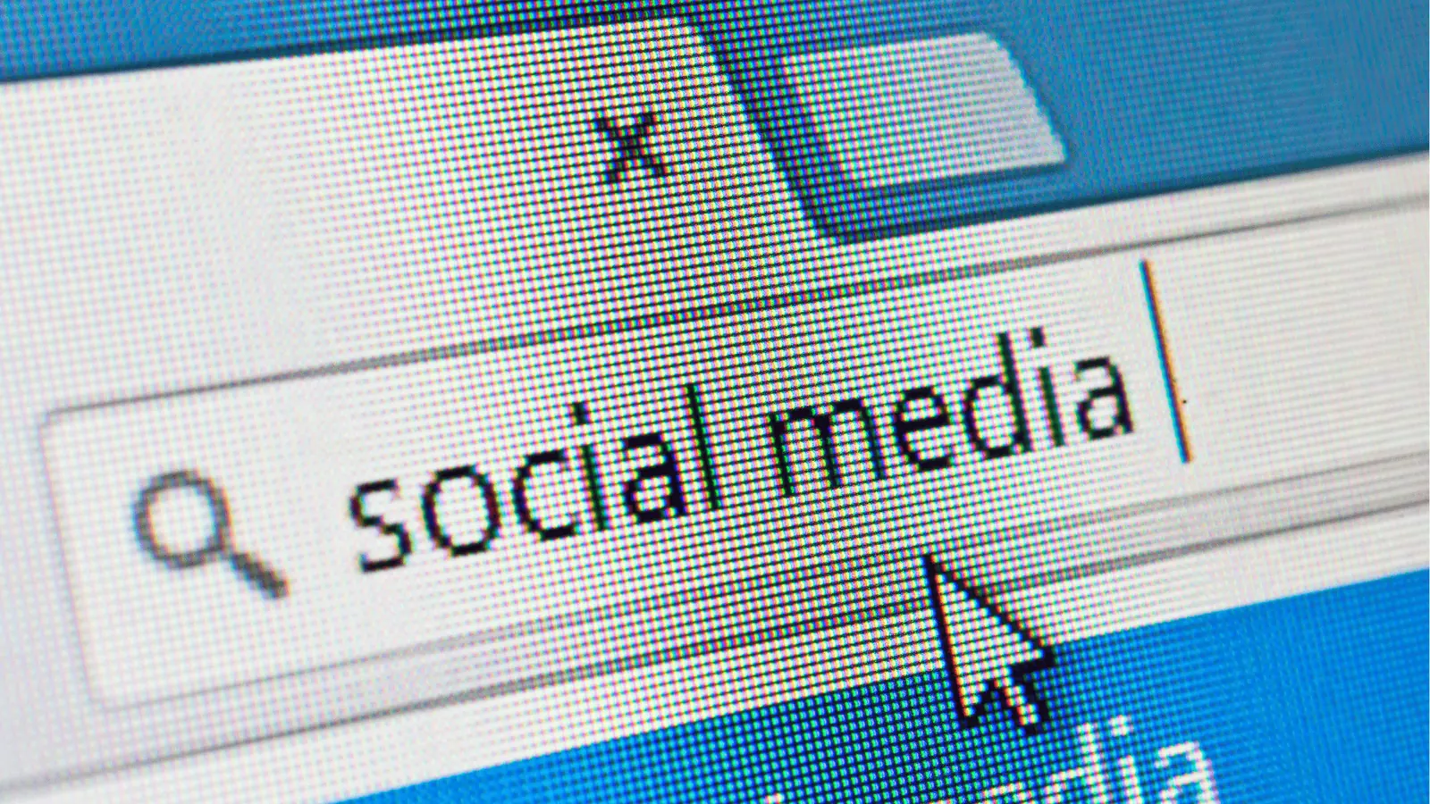 Close-up of computer screen showing 'social media' typed in search box