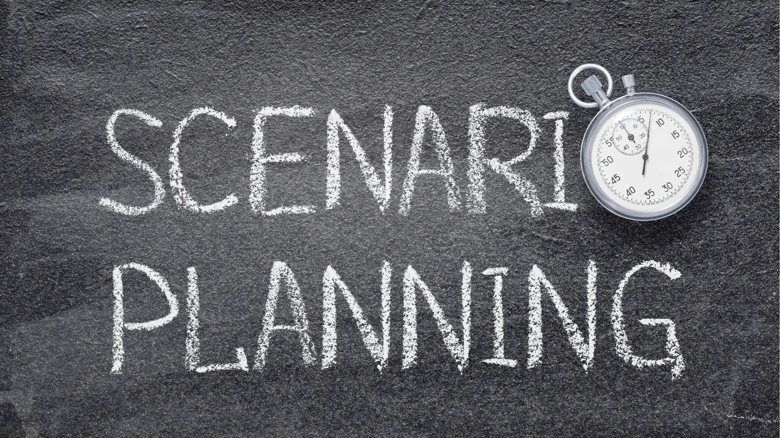 Chalkboard with 'SCENARIO PLANNING' written in chalk and a stopwatch