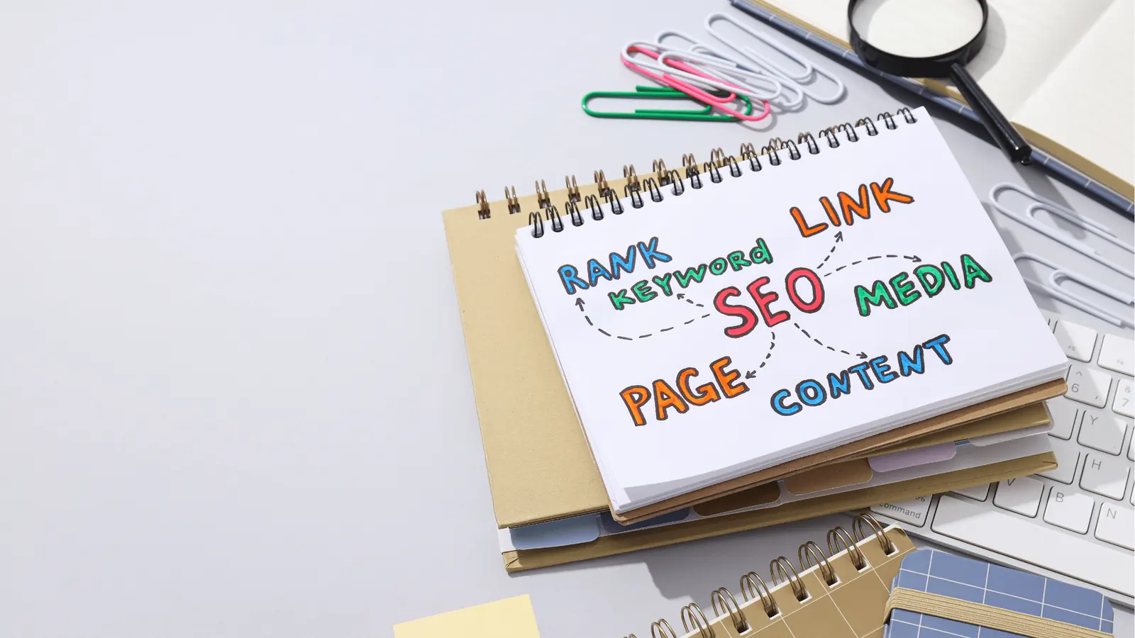 Spiral notebook with colorful hand-drawn SEO mindmap on desk