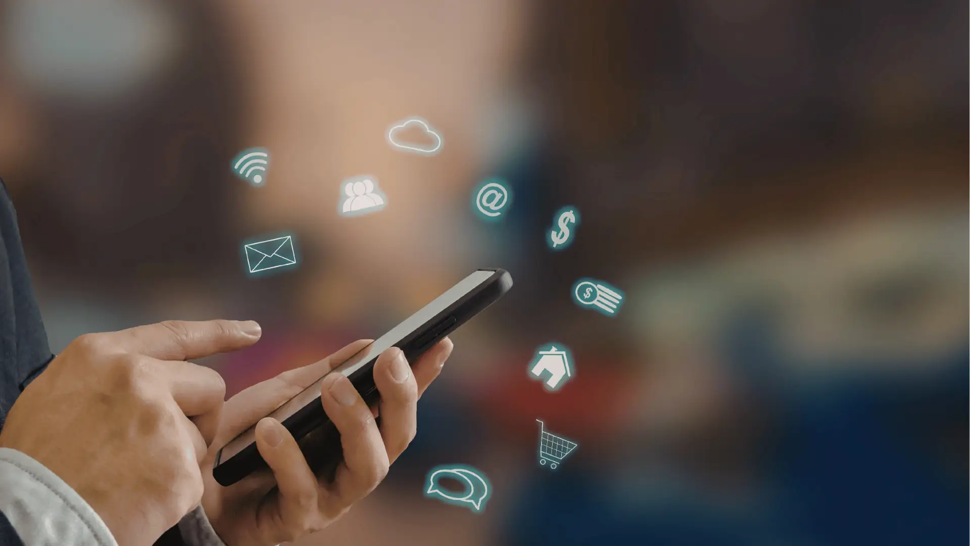 Hands holding smartphone with floating digital icons for communication and commerce