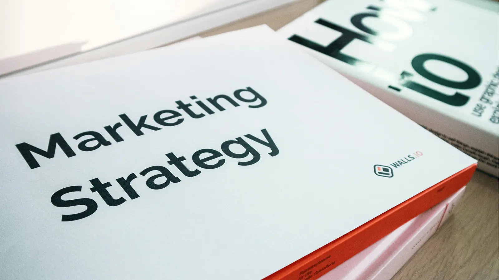 Close-up of a printed Marketing Strategy book with red spine for publishing