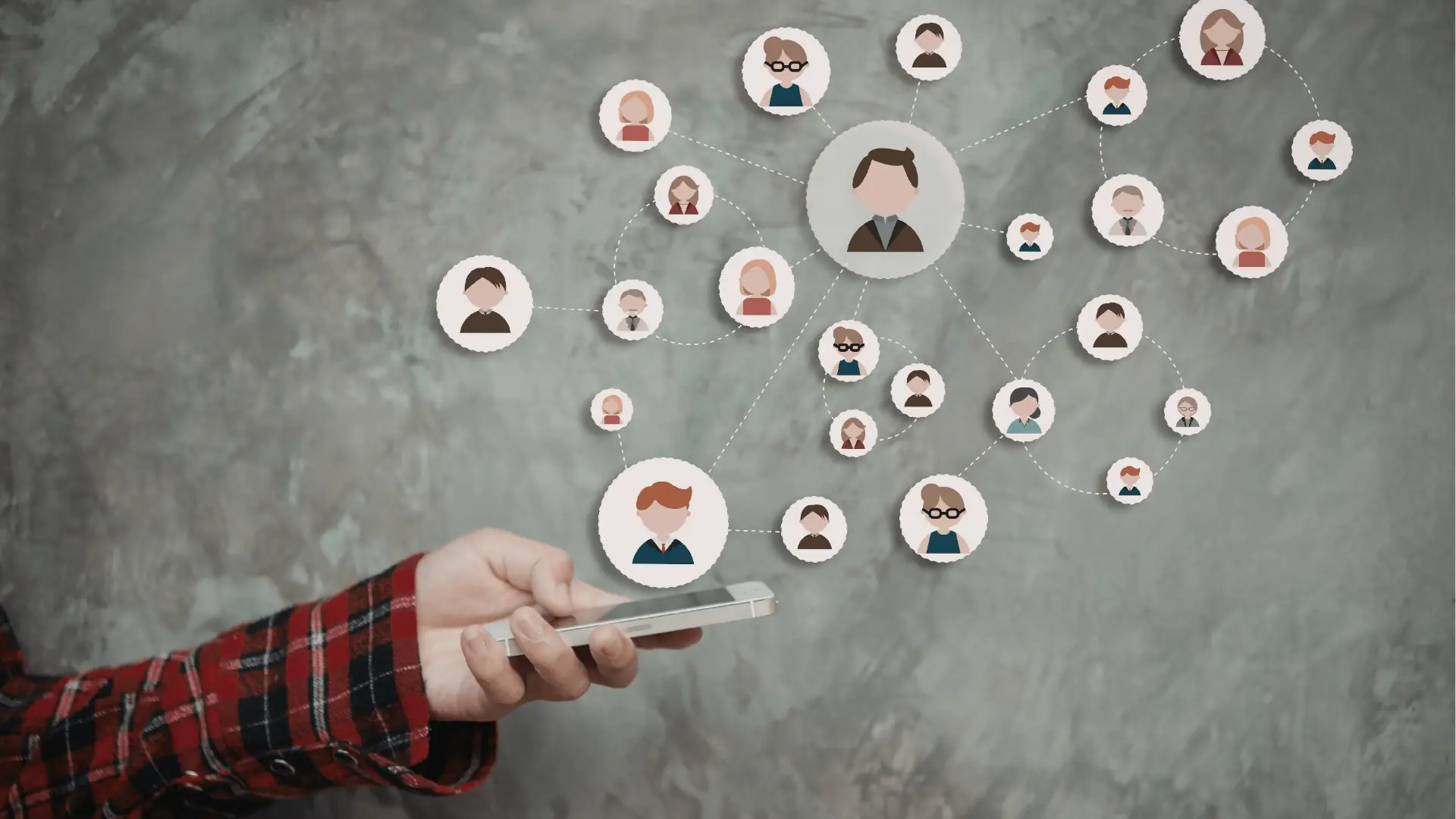 Hand holding smartphone with connected avatar icons forming a social network overlay