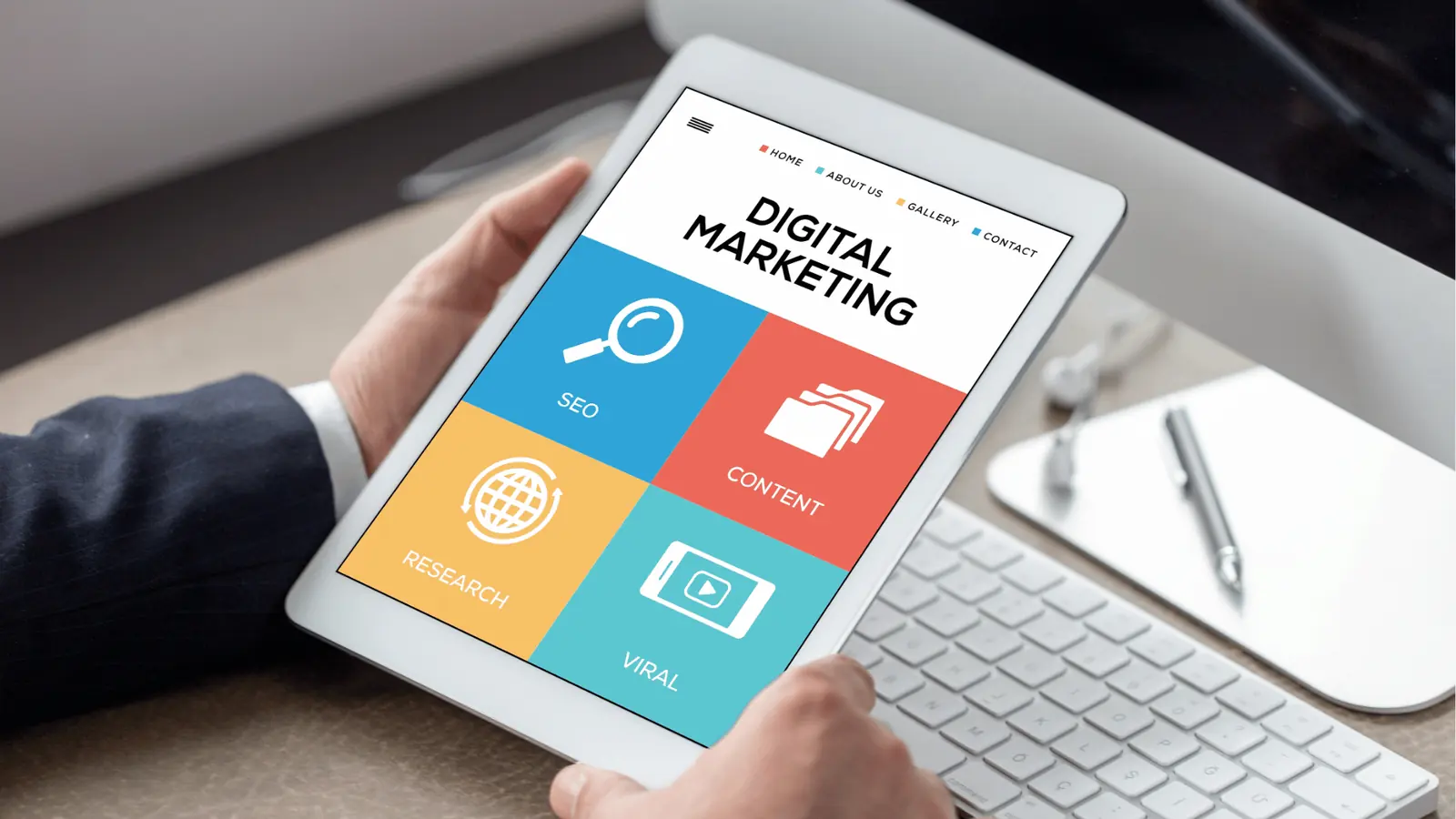 Person holding tablet displaying colorful digital marketing tiles and icons for content review