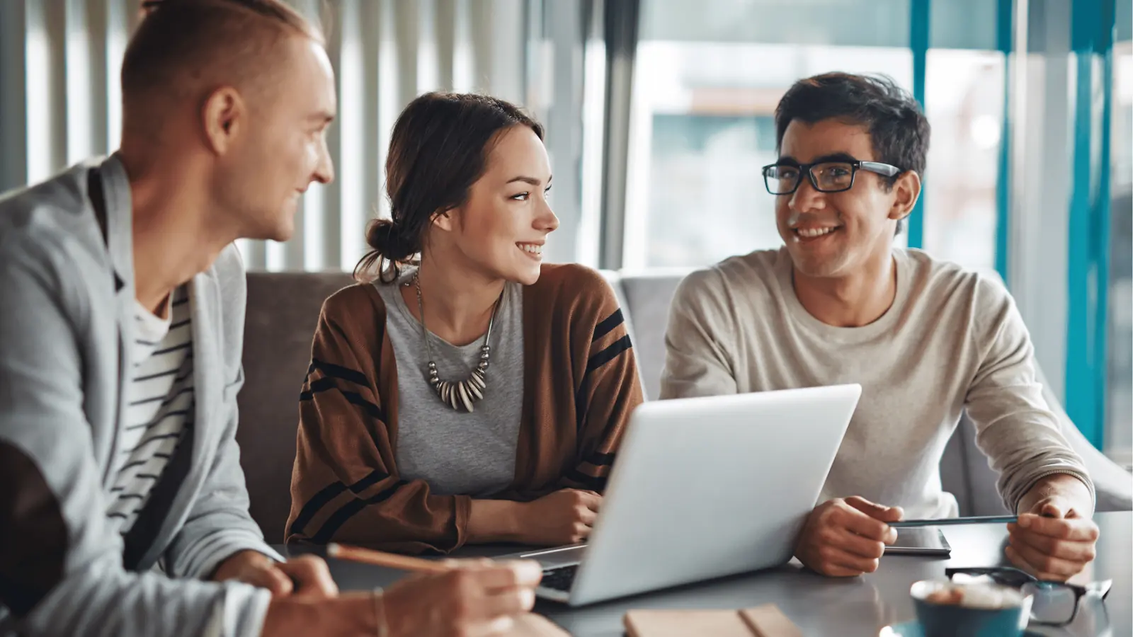 Enterprise social media team reviewing the real problem hiding under the surface in a collaborative workspace
