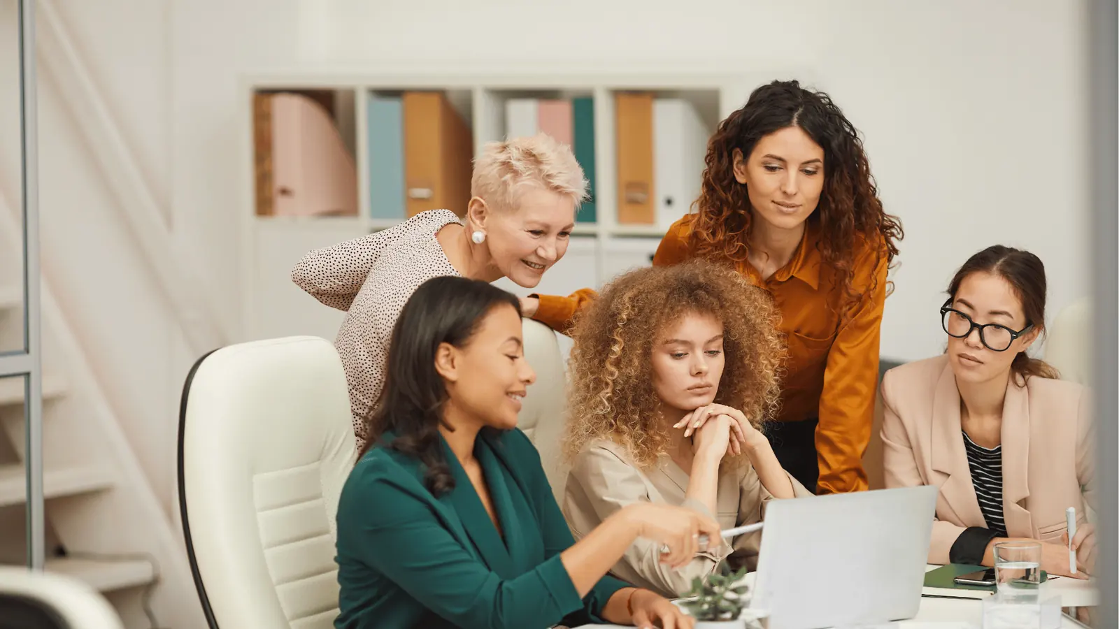 Enterprise social media team reviewing conclusion in a collaborative workspace