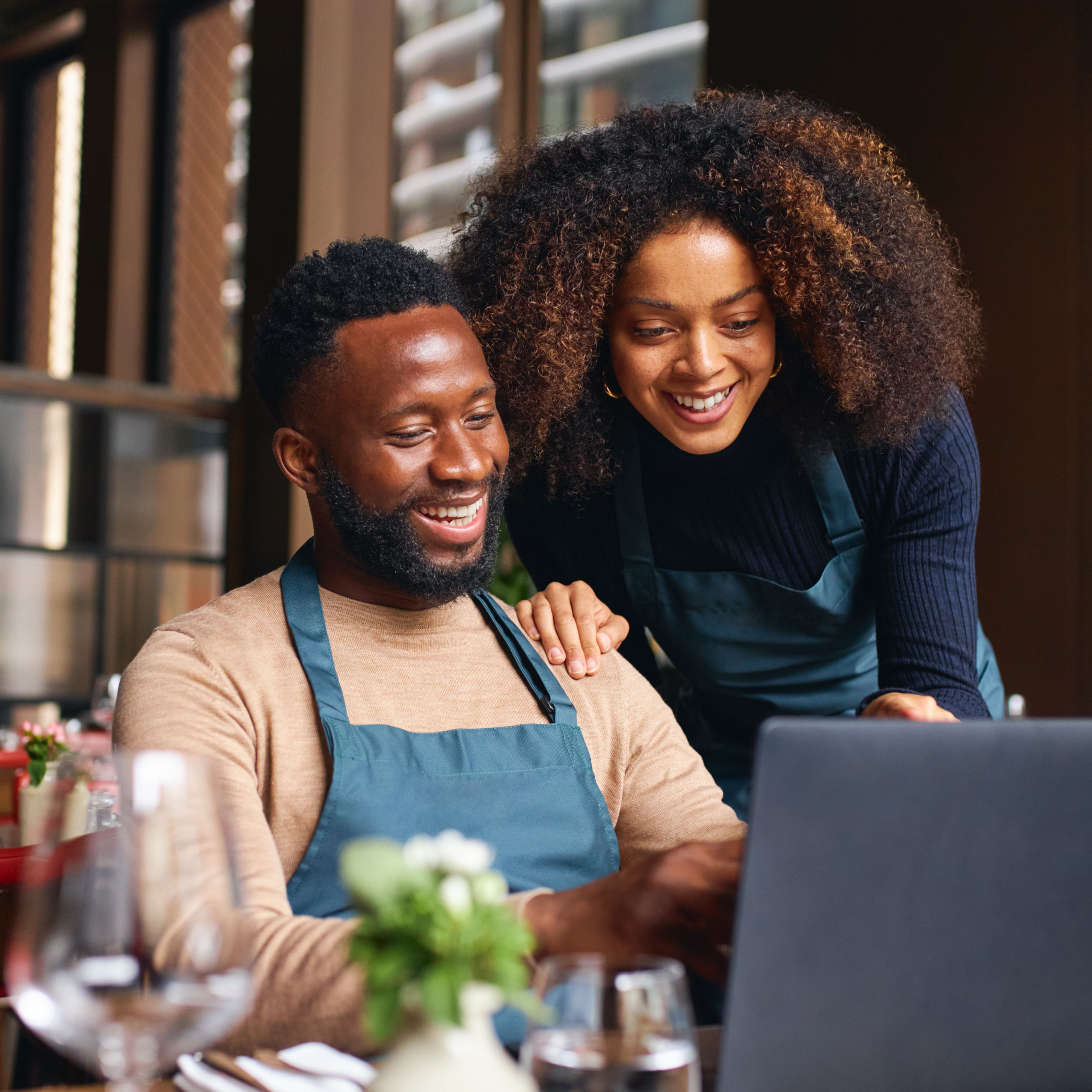 Small business owners reviewing social campaign performance together